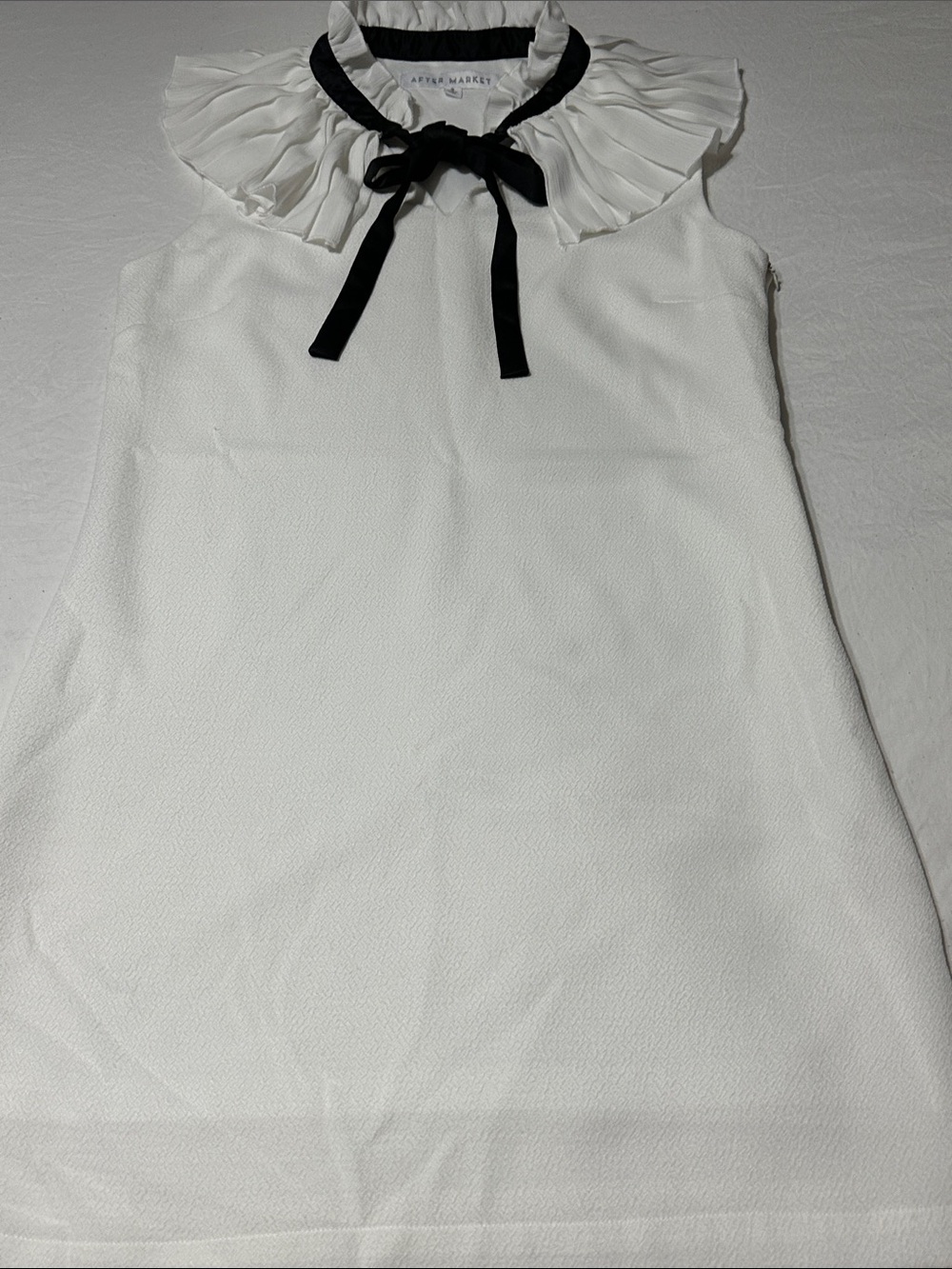 Ruffled Collar Sleeveless Mini Dress in White with Black Ribbon